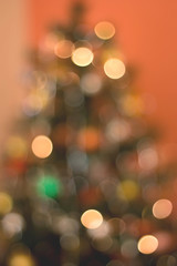 Colorful illuminated Christmas tree, defocused.