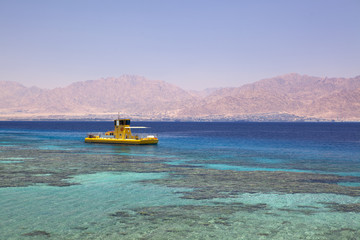Fototapeta premium Yellow boat In Red Sea, Eilat, Israel