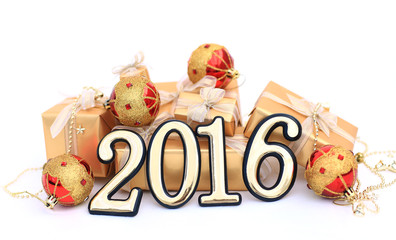 2016 year golden figures on the background of christmas decorati