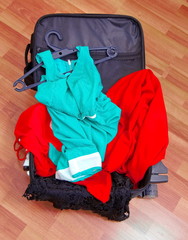 open suitcase with clothes