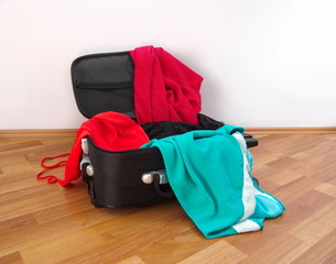 open suitcase with clothes