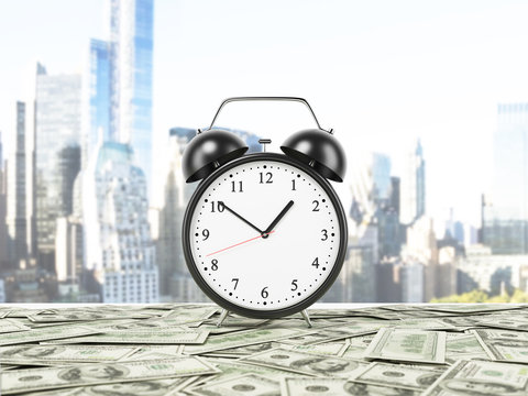 An alarm clock is settled on the surface which is covered by dollar notes. New York panorama on background. 3D rendering.
