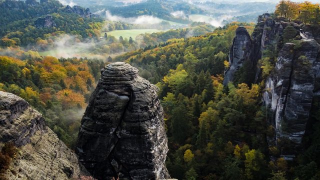timelapse of sunrise over Mountains. morning mist in the valley Bastei in Saxon Switzerland