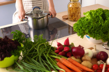 Young Woman Cooking in the kitchen. Healthy Food