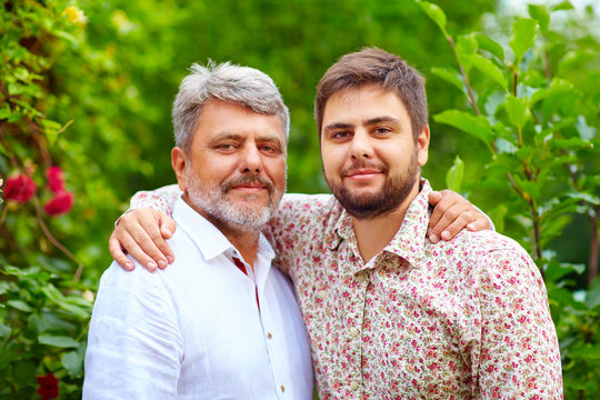 portrait of happy father and son, that are similar in appearance