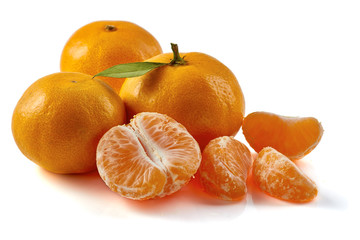Group of tangerines with slices isolated on white background