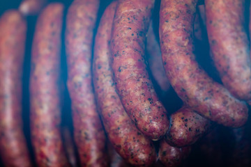 Traditional food. Smoked sausuages in smokehouse.