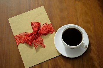 close up of a coffee cup and a blank card on a table