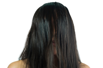 Beautiful young brunette girl with hair covering her face