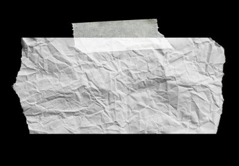 Piece of torn paper on black. Copy space