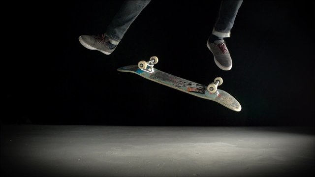Skater rolling into kickflip trick shooting with high speed camera, phantom flex.