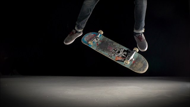 Skater rolling into kickflip trick shooting with high speed camera, phantom flex.