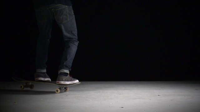Skater rolling into kickflip trick shooting with high speed camera, phantom flex.