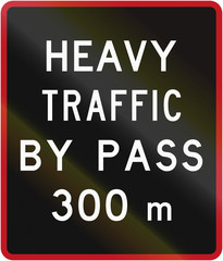 Old version of the New Zealand road sign - Bypass for heavy vehicles ahead in 300 metres