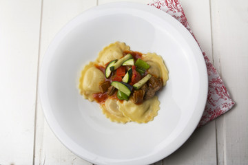 fresh meat tortellini with tomato and sauteed vegetables