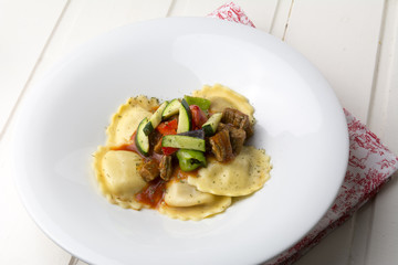 fresh meat tortellini with tomato and sauteed vegetables