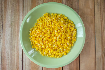 Corn in the bowl put on wood table