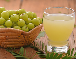 Indian gooseberry  juice on the wooden floor