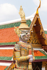 Violet Thai giant demon Yaksha statue at Wat Phra Kaew temple in Bangkok Thailand.