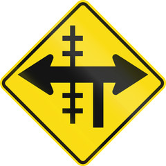 New Zealand road sign - Level crossing on controlled T-junction on left