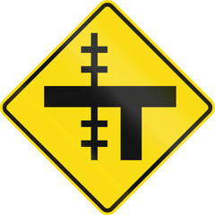 Fototapeta premium New Zealand road sign - Level crossing on uncontrolled T-junction on left