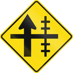 Obraz premium New Zealand road sign - Level crossing on controlled crossroad on right