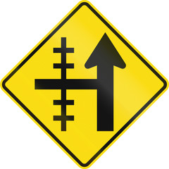 New Zealand road sign - Level crossing on controlled crossroad on left