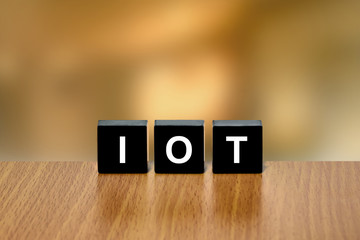 IOT or Internet of Things on black block