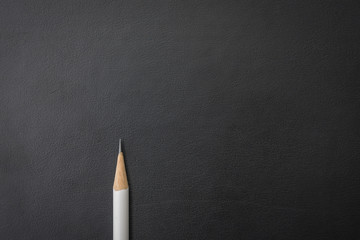 white pencil on black