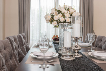 luxury dinning room vase of flower on wooden table