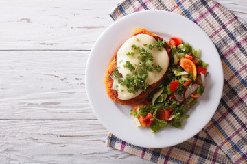 Italian chicken Parmigiana and salad. horizontal top view
