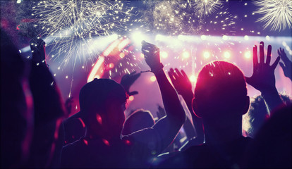 Crowd celebrating with fireworks