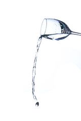 Concept of drinking. Wine glass with splash water on white background