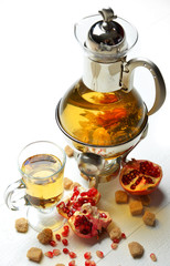 Green Tea flower composition on on rustic wood table with sugar