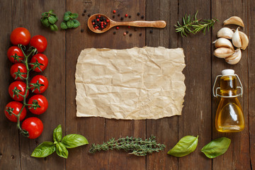 Craft paper with border of vegetables,  herbs and olive oil