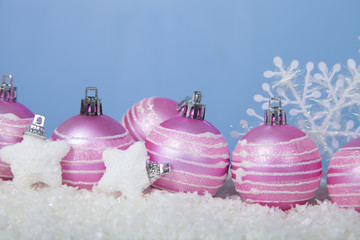 Pink balls on the snow