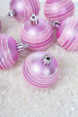 Pink balls on the snow