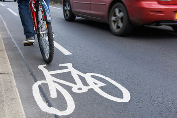 Man On Bike Using Cycle Lane As Traffic Speeds Past