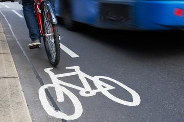Man On Bike Using Cycle Lane As Traffic Speeds Past