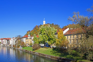 Fototapeta na wymiar Medieval Castle in Ljubljana situated on top of the Castle Hill, Slovenia. View from River Ljubljanica.