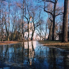 reflection of a church in the puddle