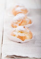 Profiteroles, choux with a custard cream. Dessert 