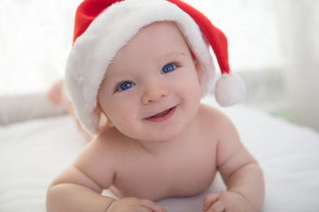 christmas cute baby boy lying on white soft plaid