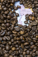 Map of Thailand under a background of coffee beans