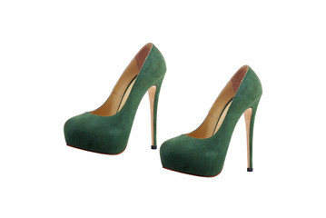 Female high-heeled shoes over white background