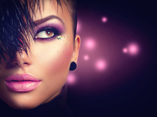 Sexy model girl face closeup with holiday bright purple makeup