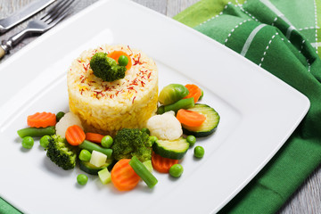Portion of risotto with vegetables.