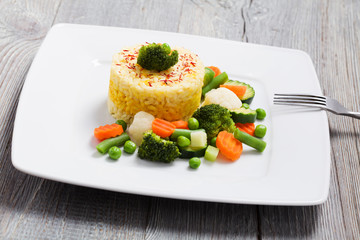 Portion of risotto with vegetables.