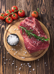 Raw marbled meat steak Ribeye on dark wooden background