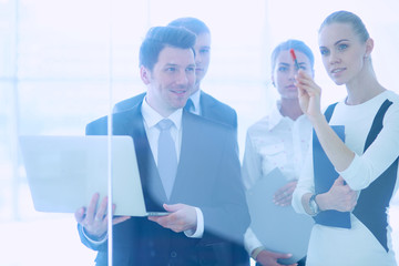 Group of  business people doing presentation with laptop during meeting
